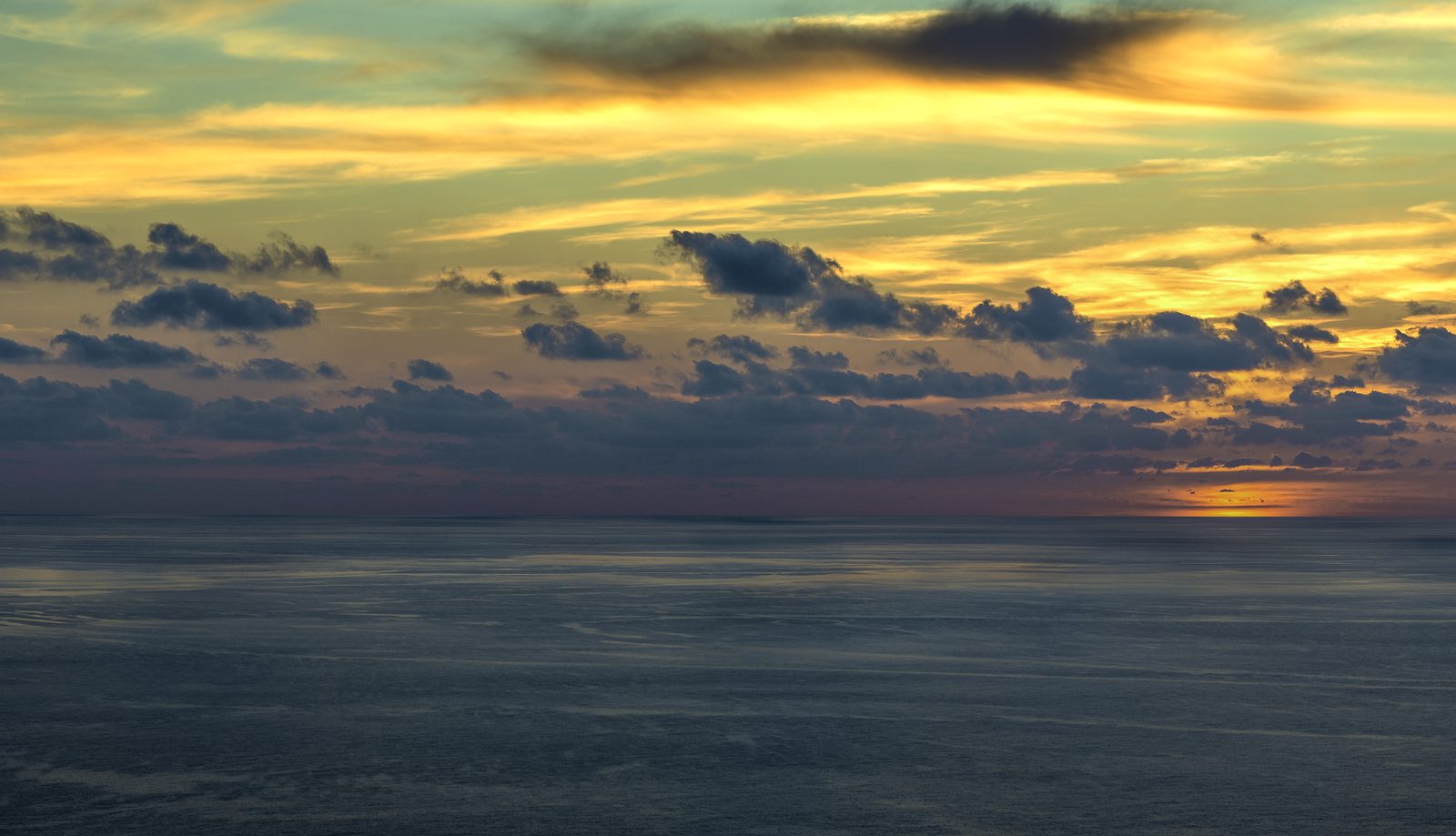 A deep red sunset over the sea below Dingli cliffs, Malta