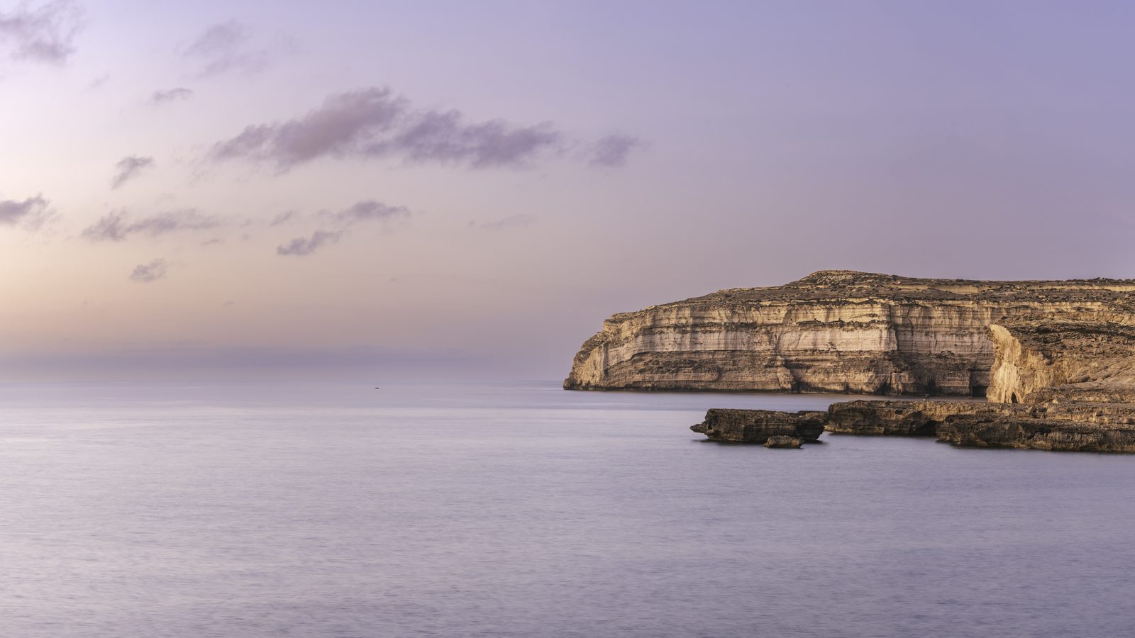 A pastel panorama of the Dwejra coastline, Gozo