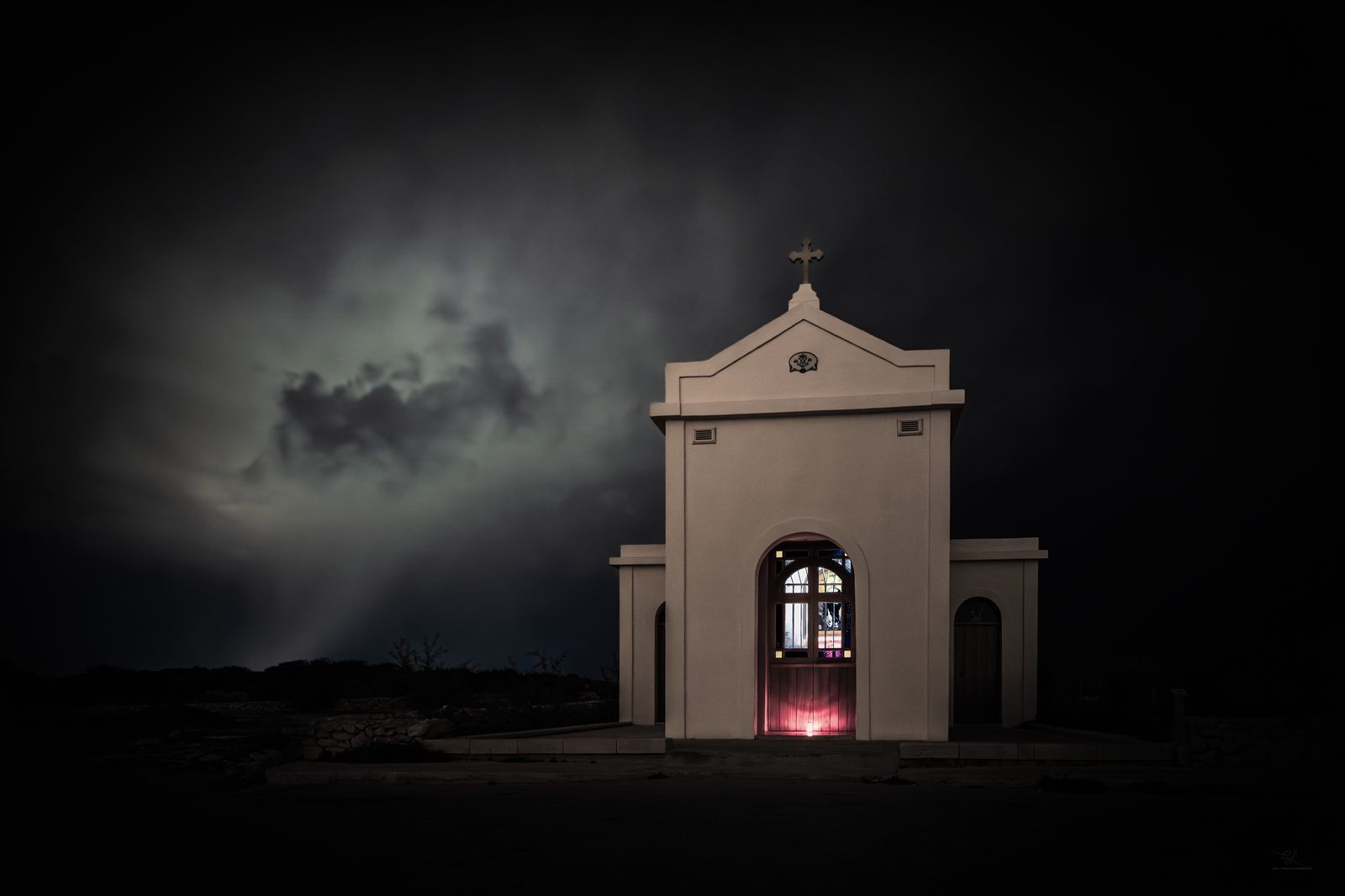 The Chapel of the Immaculate Conception at Mellieħa under a building storm sky