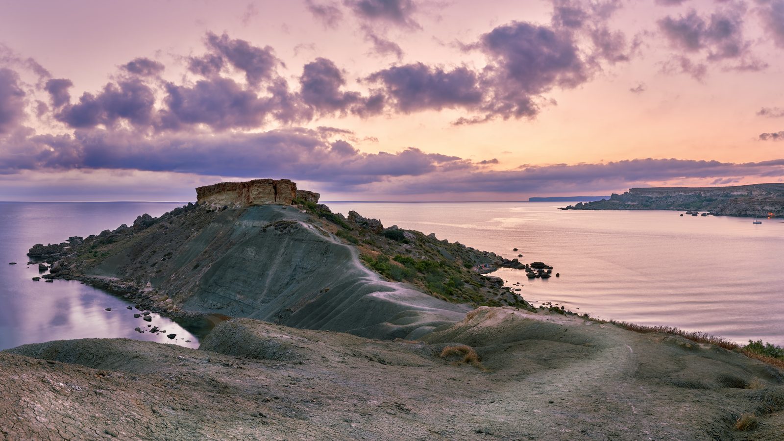 The clay ridge running to Il-Qarraba between Qarraba Bay and Riviera Beach at sunset, Malta